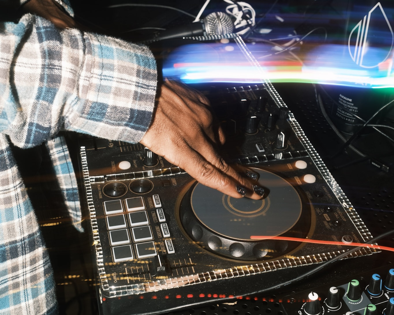 The SEVENth's hand on a jog wheel during a live set